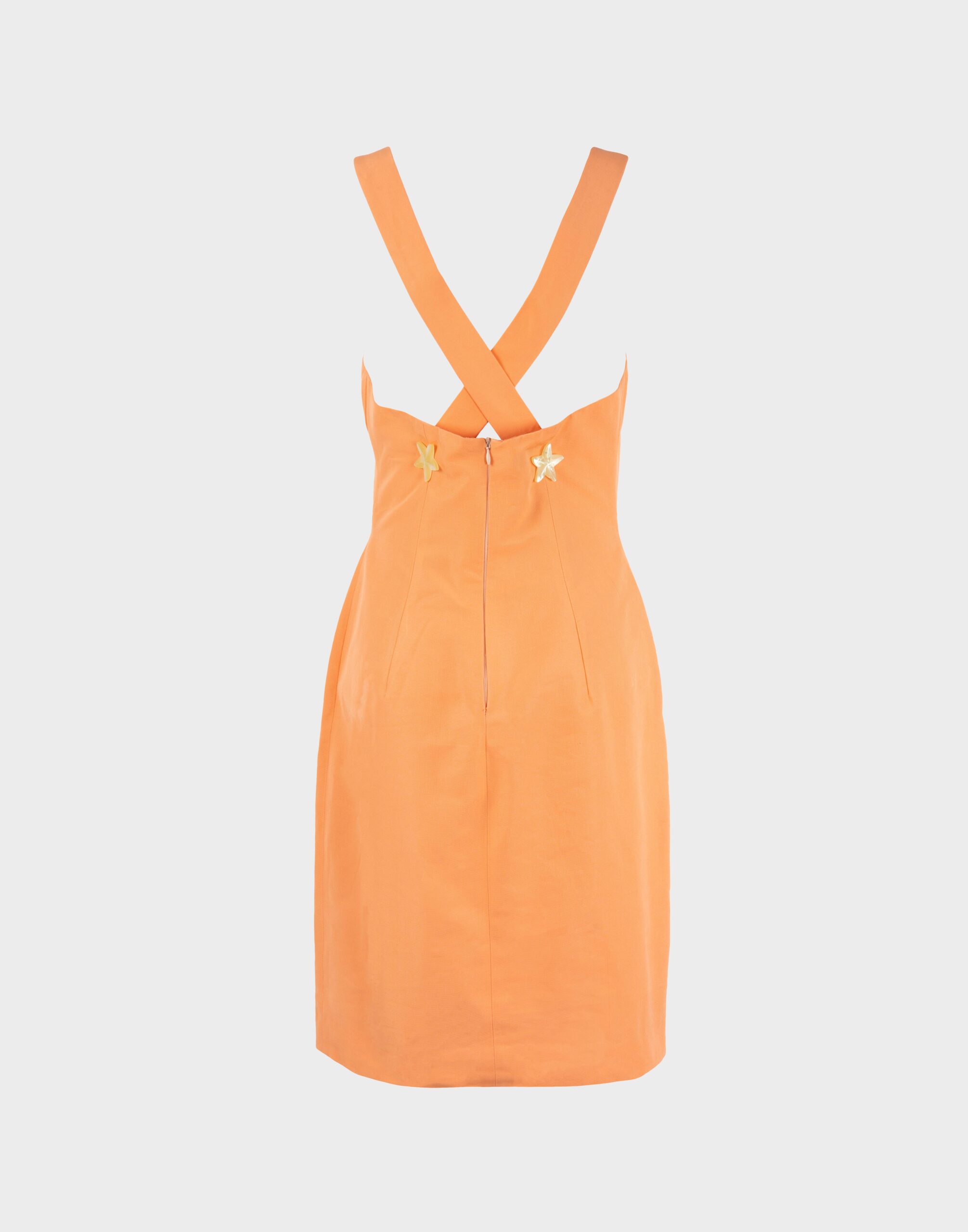 coral-coloured summer woman's dress with V-neck, mother-of-pearl stars applied on the front, crossed braces on the back