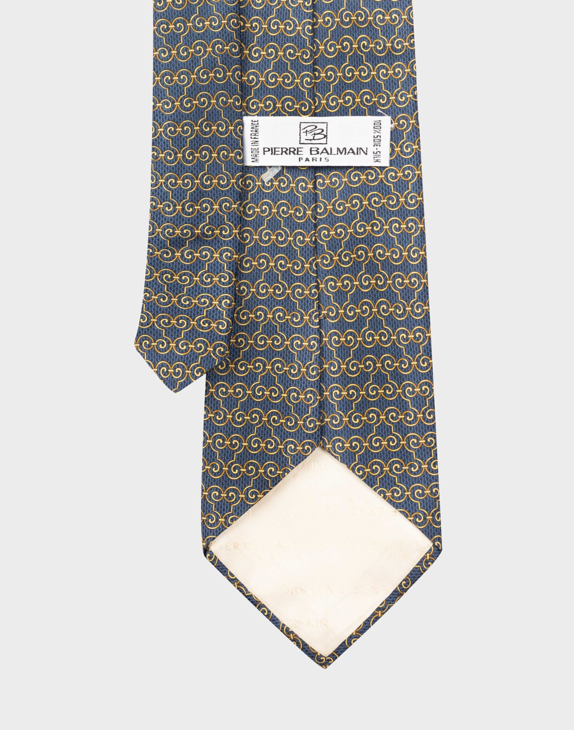 blue silk tie with gold geometric pattern