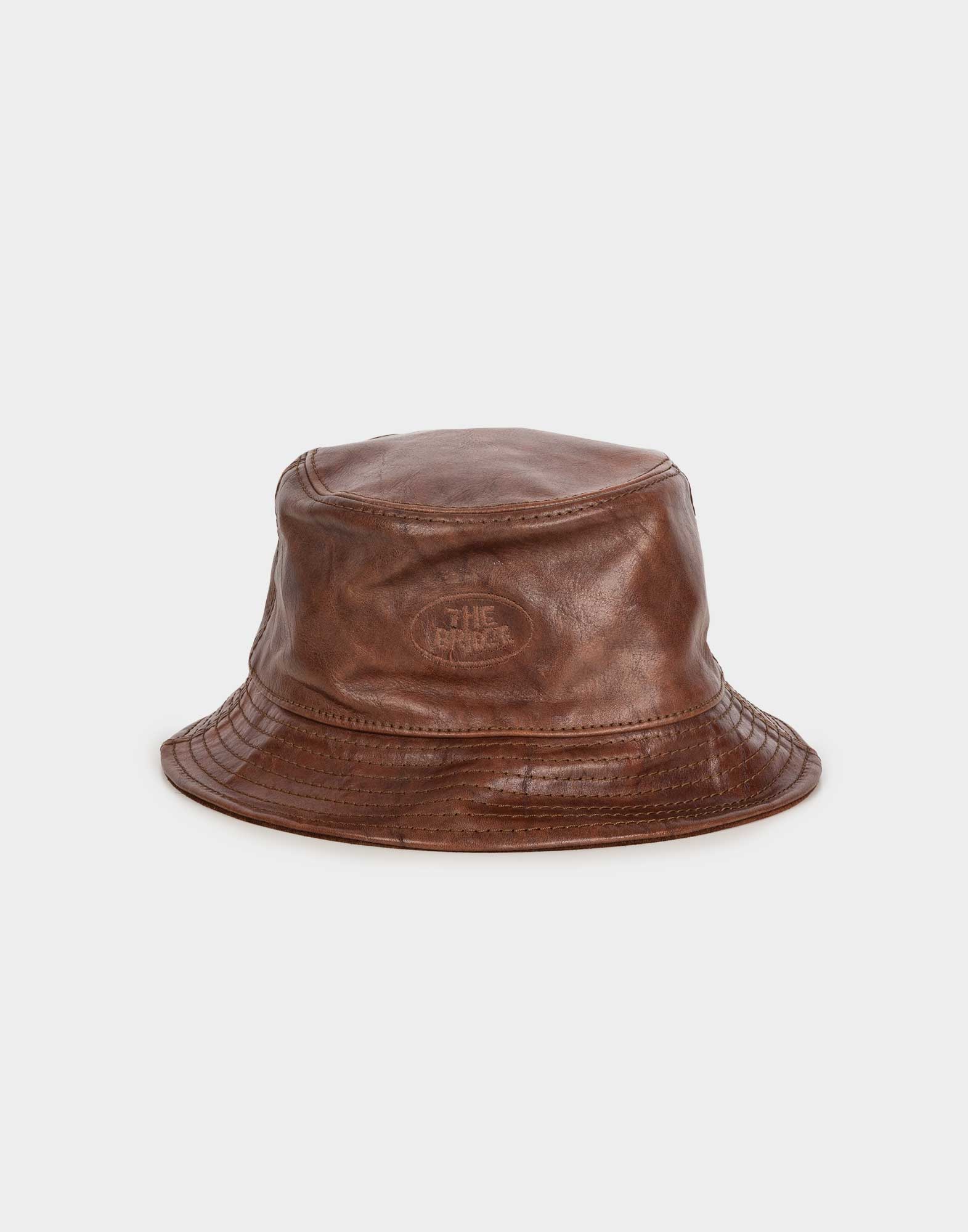 brown leather fisherman's hat with the bridge logo embroidered on the front