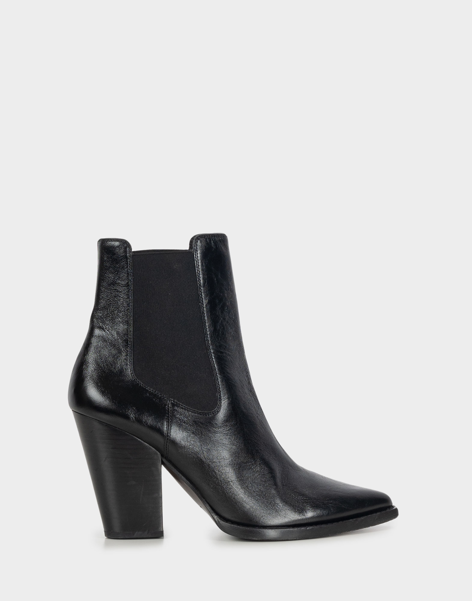 Black leather women's ankle boots in camperos style, signed Saint Laurent, model Theo.