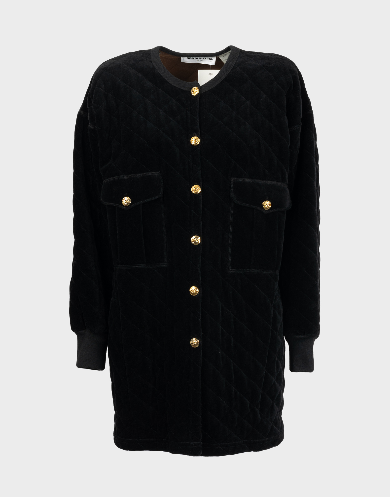 1980s black women's oversized jacket with a quilted effect, two front pockets, and a gold button closure.