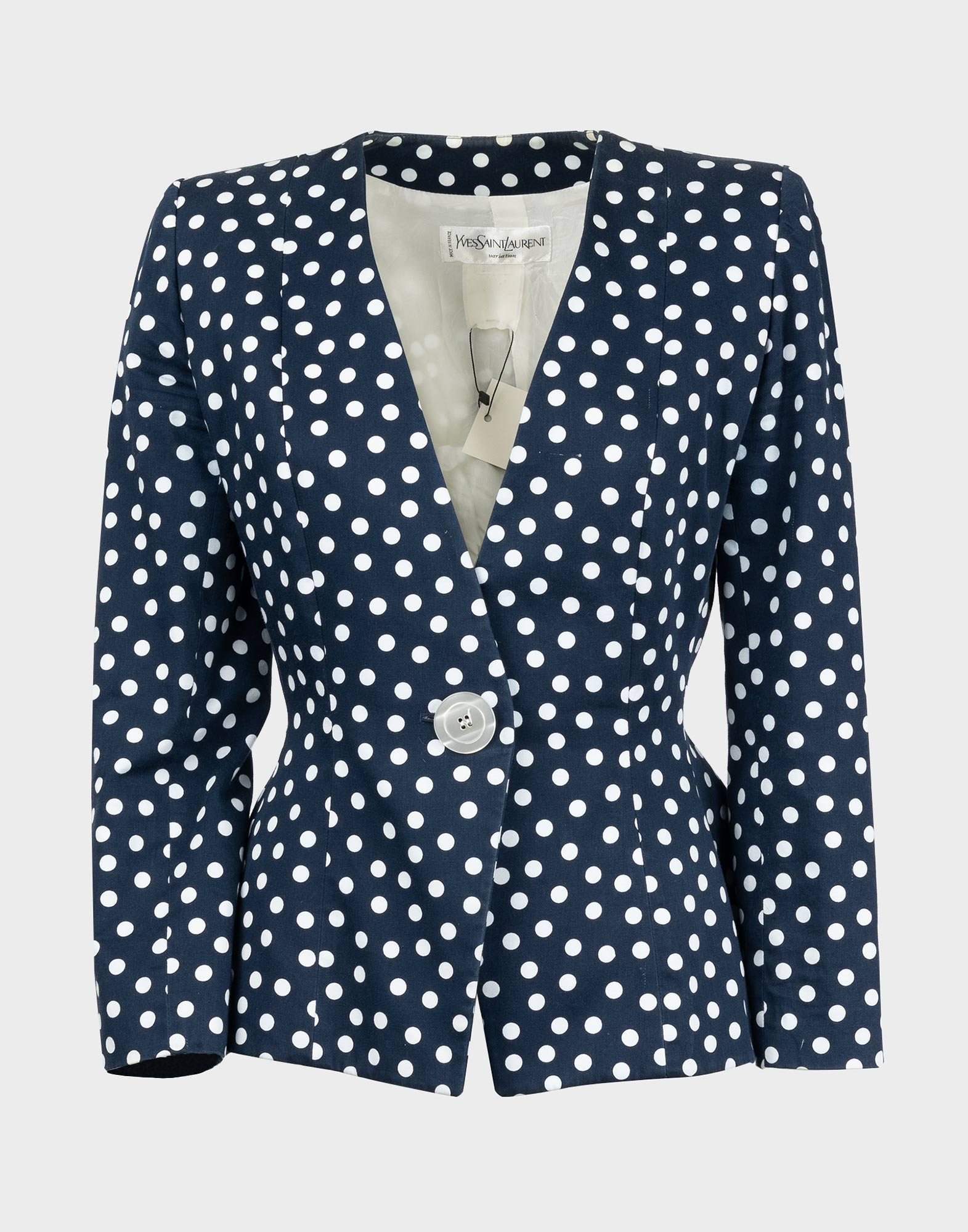 giacca da donna blu con fantasia a pois bianchi, chiusura con bottone unico bianco perla, scollo a v profondo