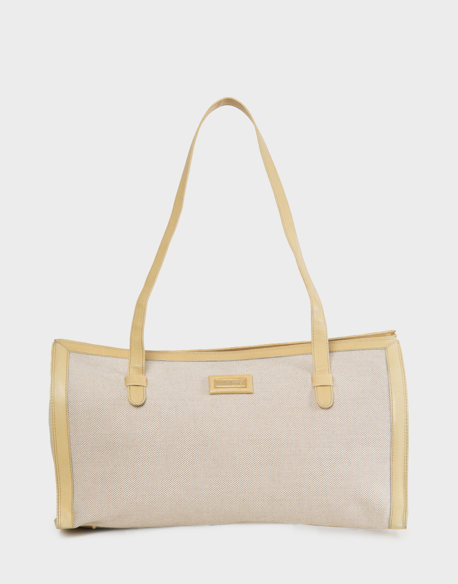 borsa rettangolare da donna in tela di colore beige con doppio manico in pelle color burro