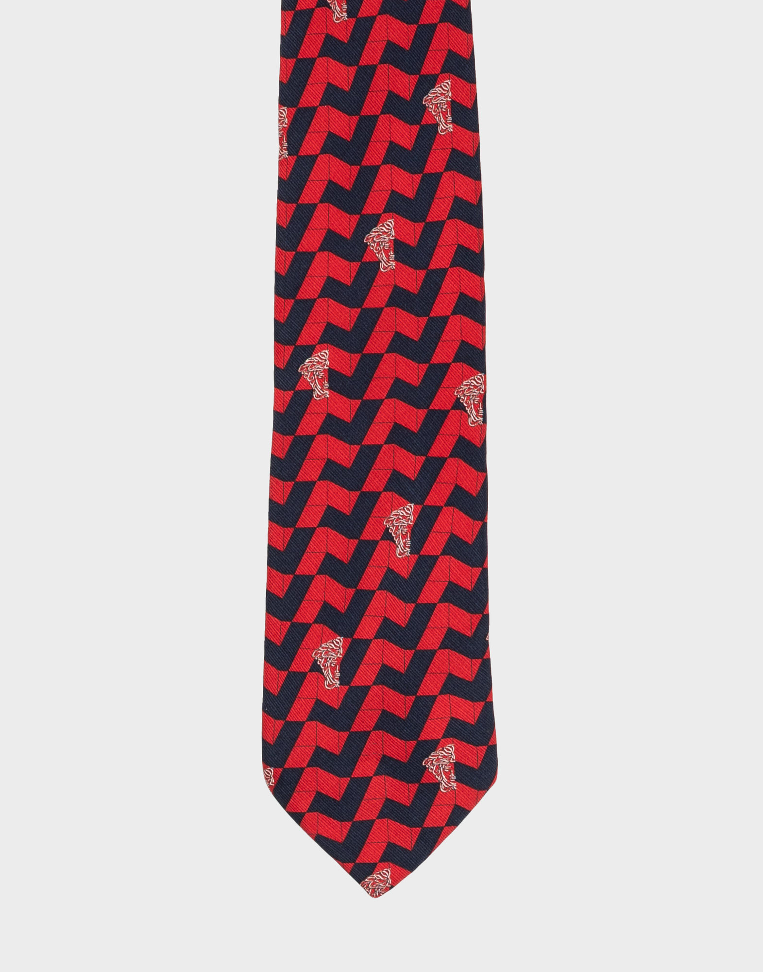 cravatta gianni versace con fantasia geometrica rossa e blu, testa di medusa di colore bianco