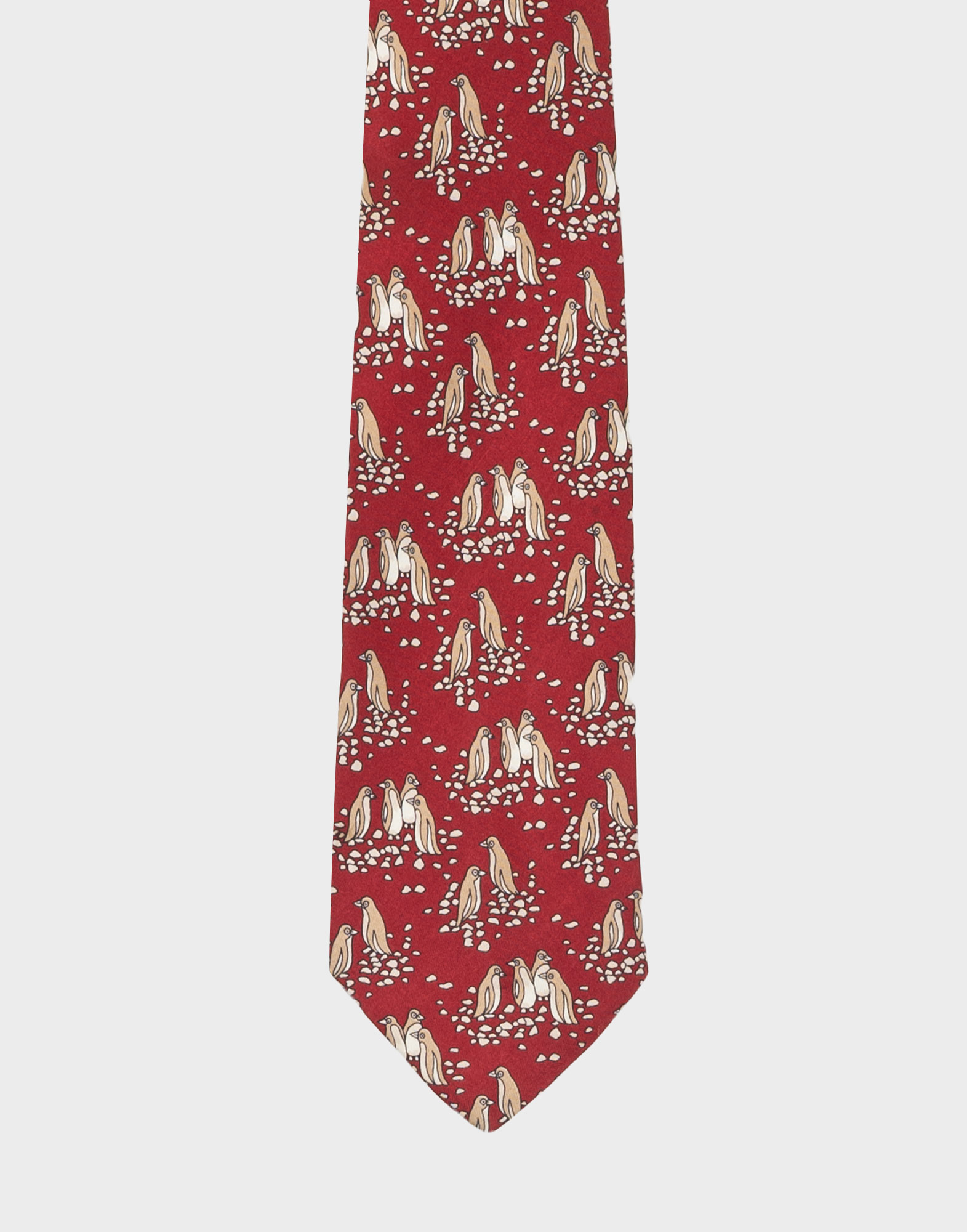 cravatta rossa in seta hermes con fantasia di pinguini beige