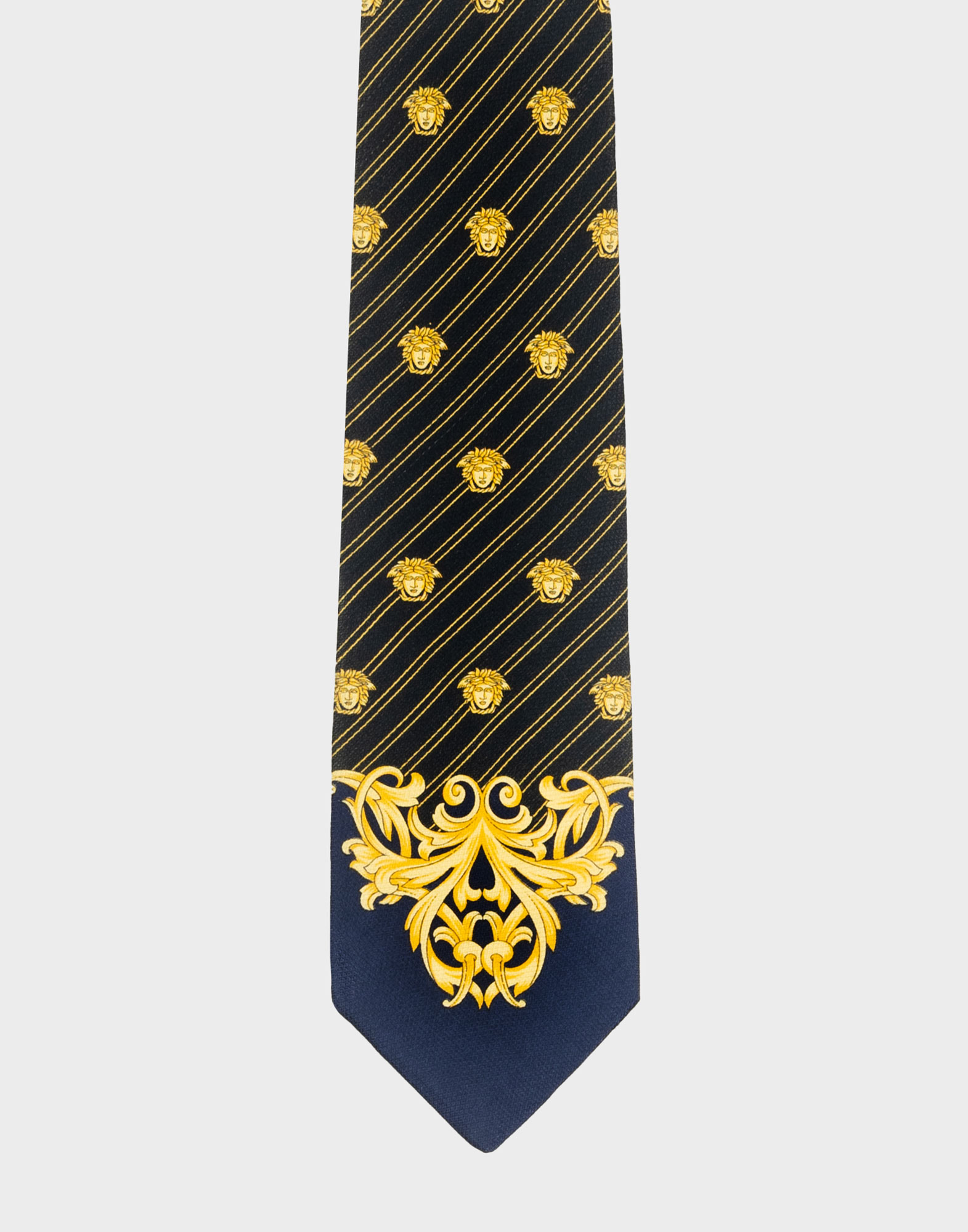 cravatta nera e blu in seta versace con fantasia diagonale e teste di medusa di colore giallo