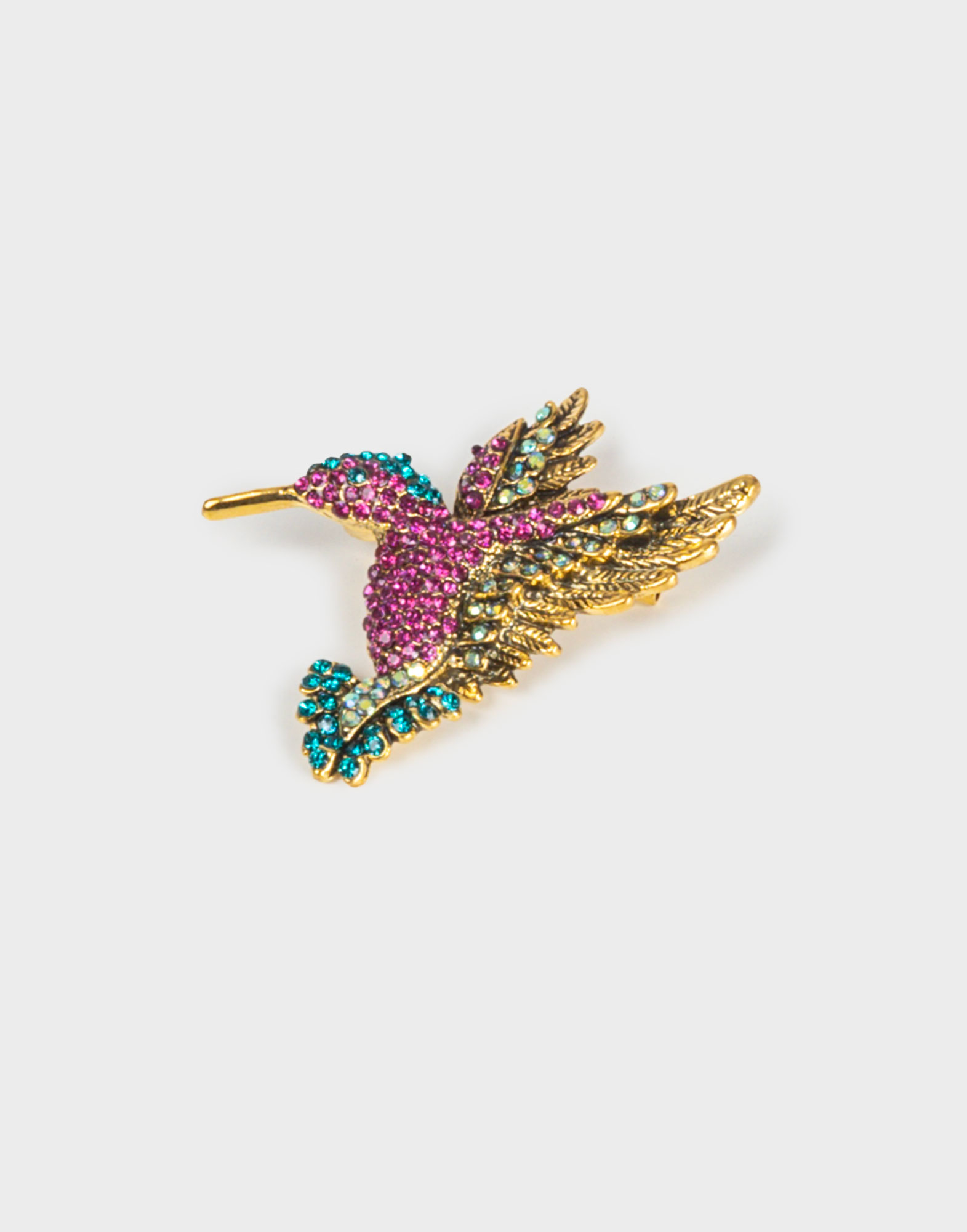spilla dorata a forma di colibri con strass colorati fucsia, verdi e azzurri