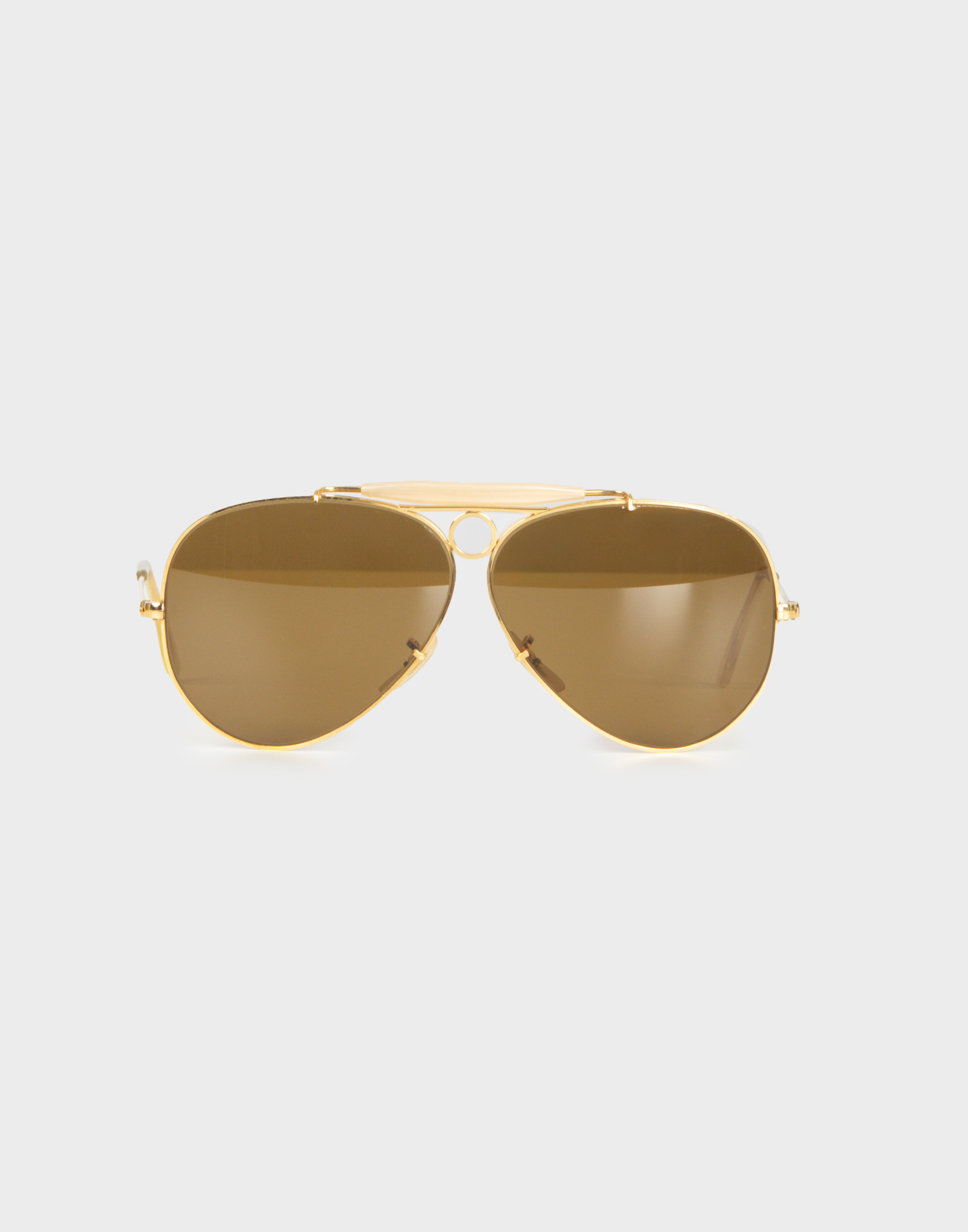 ray-ban 80s aviator model sunglasses with gold frames and brown lenses