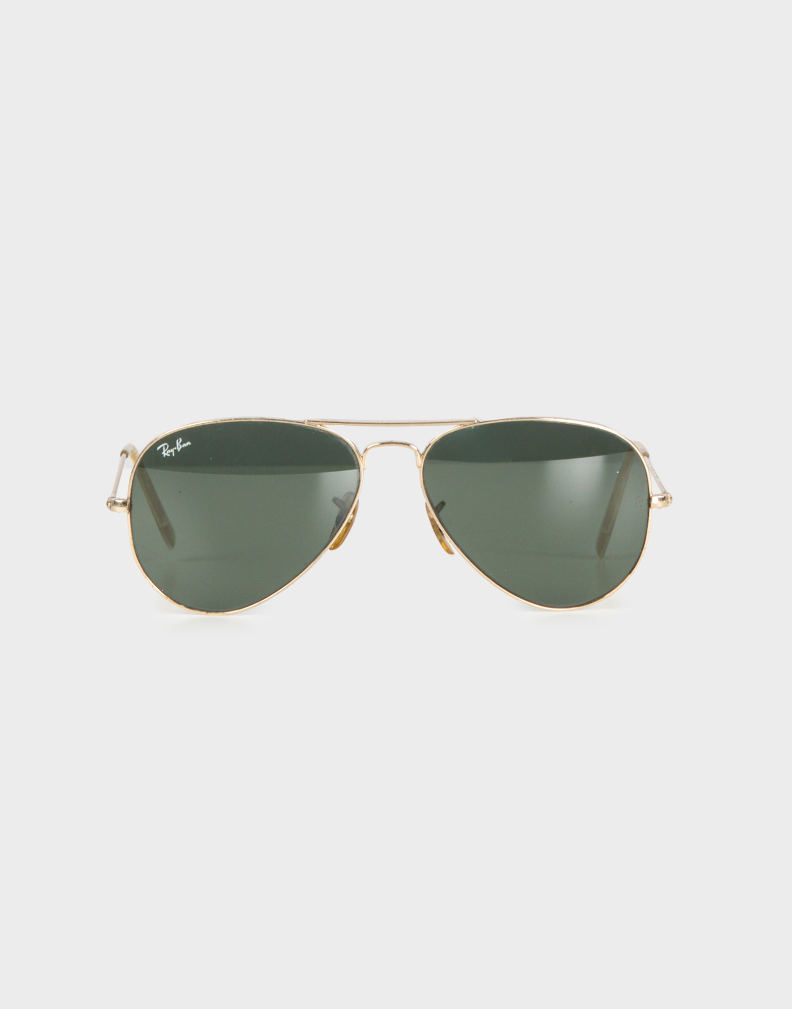 occhiali da sole ray-ban neri modello aviator anni '90, montatura dorata e lenti verde scuro
