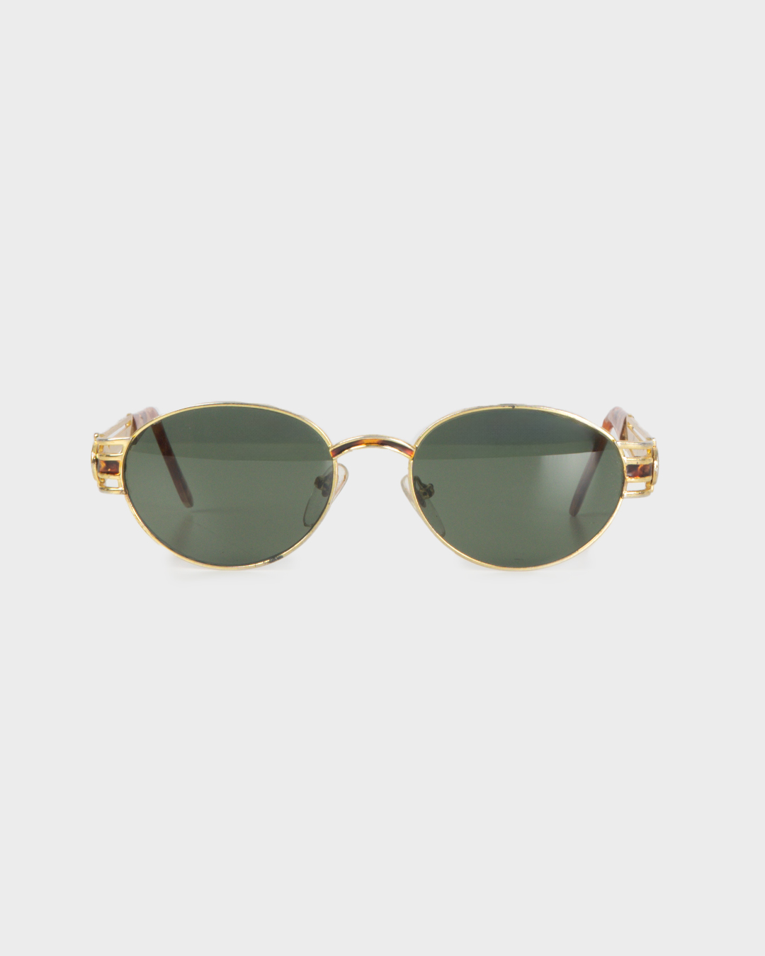 Vintage gold oval glasses with green lenses and marbled details